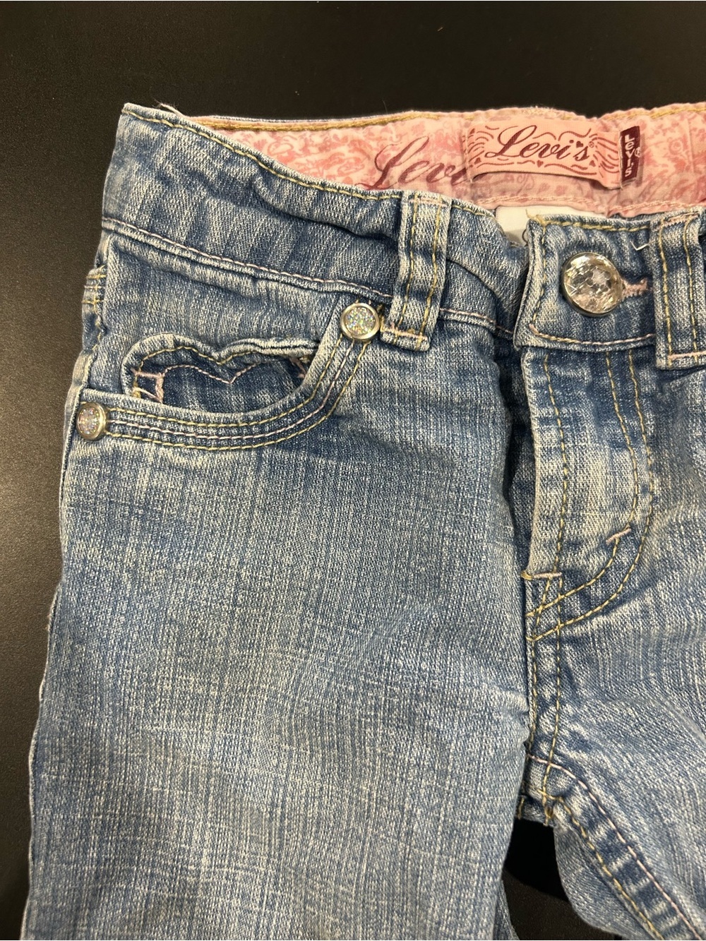 Girl’s Light Wash Levi’s Flared Jeans with Heart Pockets and Gem Details